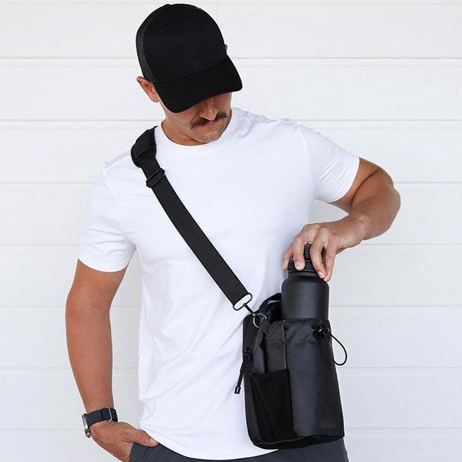 Black magnetic fitness pouch attached to gym equipment